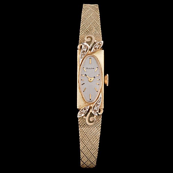 Bulova Watch with Box : American, ca 1940. A Bulova 14K yellow gold watch with diamond accent, probably 15-jewel; lg. 8 in., wt. with movement and band 22.0 dwts.