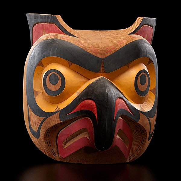 Tony Hunt Jr. Kwakwaka'wakw Carved Mask Kwagiulth O: carved cedar and painted in black, yellow, and red; with wide-eyes and softly carved bent beak; signed, titled, and dated in pencil on reverse, length 10.5 in. x width 10.25 in. 1982