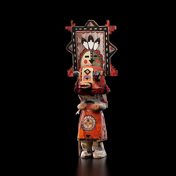 Southwestern Display Katisna : painted in oranges, reds, blues, black, and white; carved with pop-eyes, snout, and separate tableta, height 31.5 in. first quarter 20th century