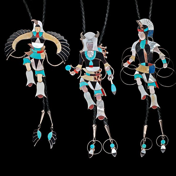 Jonathan Beyuka Zuni Inlay Bolos : lot of 3, including Eagle Dancer, Buffalo Dancer, and Hoop Dancer; each with inlay silver drops; each signed on reverse, lengths of figures 5 to 6 in. late 20th century