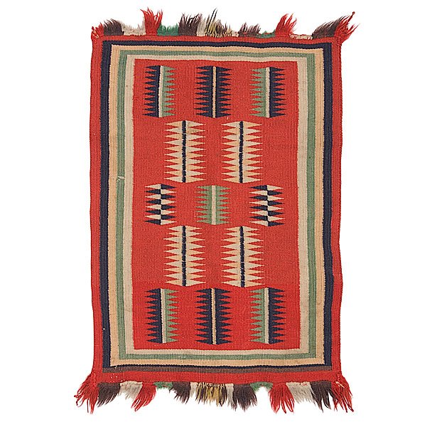 Navajo Germantown Sampler : woven in colors of red, blue, green, and cream; with central field filled with stacked diamonds of varying color to create an eyedazzling effect; added fringe along edges, 28 x 17.75 in. late 19th cen