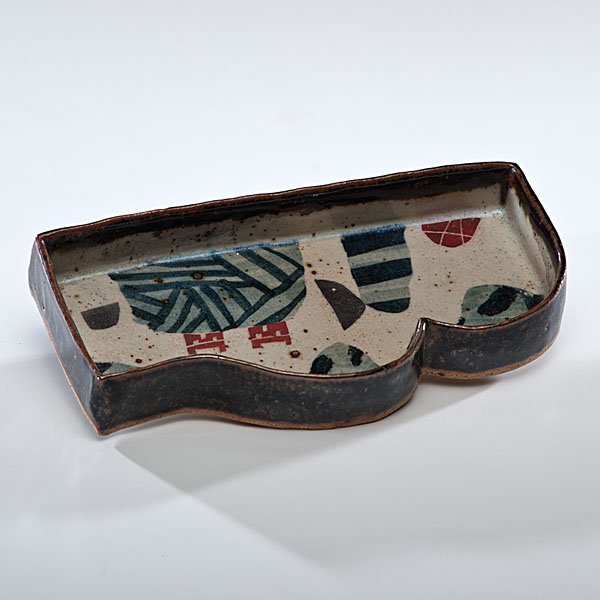 John Maltby (1936, England) : Sided Dish 1983 Stoneware, ht. 1.5, wd. 9.75, dp. 5 in. Provenance: Daniel Jacobs and Derek Mason Collection; Acquired from Beaux Arts, Bath, UK, 1983.