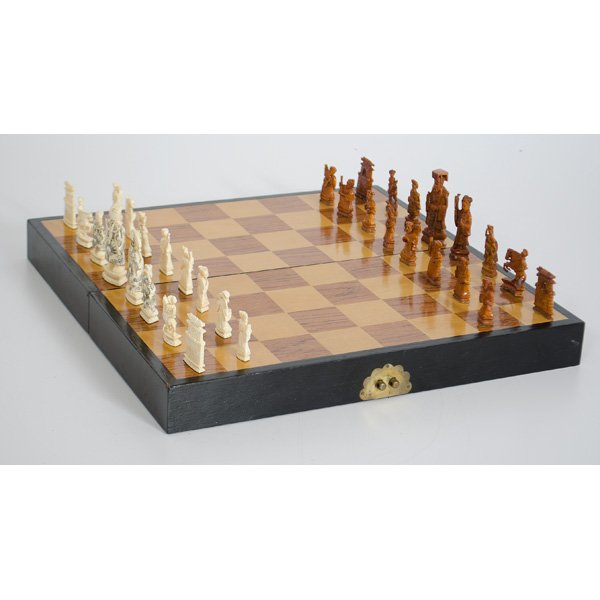 Chinese Carved Ivory Chess Set : China. An export chess set with pieces all carved in ivory, fully complete; board 16 x 16 in.