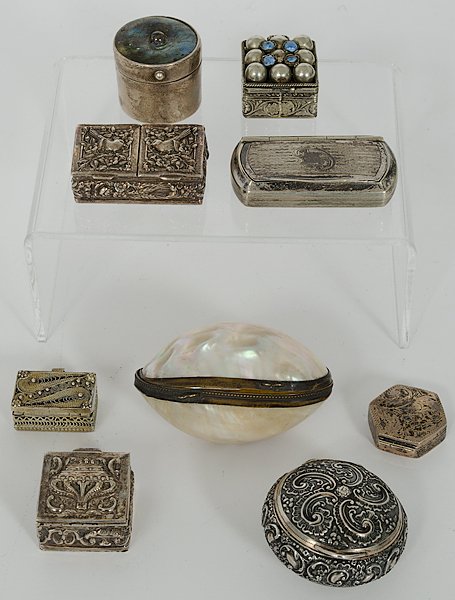 Silver Pill Boxes : Italian, Israeli, and other, all late 19th- to 20th century. A group of seven pill boxes, one shell box and a silver match safe, some marked, some unmarked; largest, 2.75 in., smallest, 1 in.