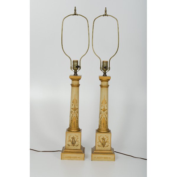 French Tole Painted Table Lamps : Continental. A pair of French tole painted columnar-form lamps on a pedestal base, each with painted classical decoration including lyres, cornucopia, and acanthus leaves, unmarked; ht. 19 in, over