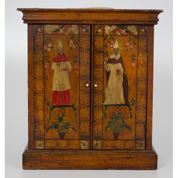 Continental Painted Hanging Cupboard : Continental (Eastern European). A stained and painted hanging cupboard with a molded cornice over two doors opening to an interior with two compartments and a single drawer, on a molded base, the cabi