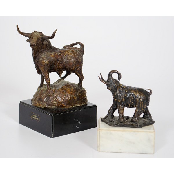 Heriberto Juarez (Mexican, 1932-2008), Bronze Bull: Bronze sculpture, one depicting a bull on a black marble base, the other depicting an elephant on a white marble base, H.Juarez impressed into bronze on both and each having a plaque affixed to marble