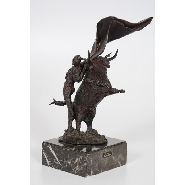 Heriberto Juarez (Mexican, 1932-2008), Bronze Mata: Bronze on marble base, depicting a standing matador with flowing cape leaning against a rearing bull, H. Juarez incised into bronze and Escultor/H. JUAREZ on plaque affixed to marble base; ht. 16.5 in