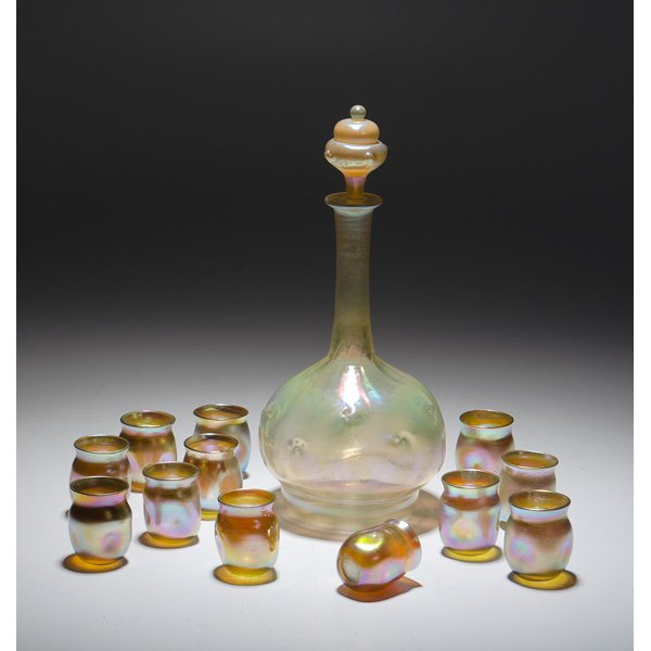 Tiffany Studios Gold Favrile Decanter and Cordials : Tiffany Studios Gold Favrile Decanter and Cordials American, early 20th century, a Tiffany decanter in gold iridescent glass with pinched detail to