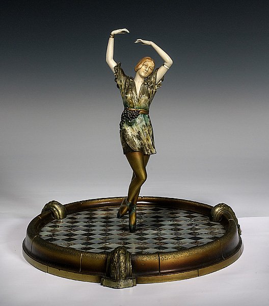 Cold Painted Bronze and Carved Ivory Figure after : Cold Painted Bronze and Carved Ivory Figure after D. Charol Continental, ca. 1920s. A cold painted bronze and carved ivory figure of a dancer after Dorothea Charol, the female figure depicted en poi