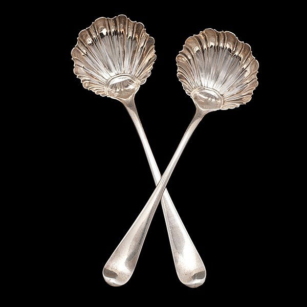 Pair of George III Sterling Condiment Ladles : Pair of George III Sterling Condiment Ladles English, 1776. A pair of English sterling silver condiment ladles with shell form bowls, hallmarked for London, dated 1776, and maker's mark T.C. for sil