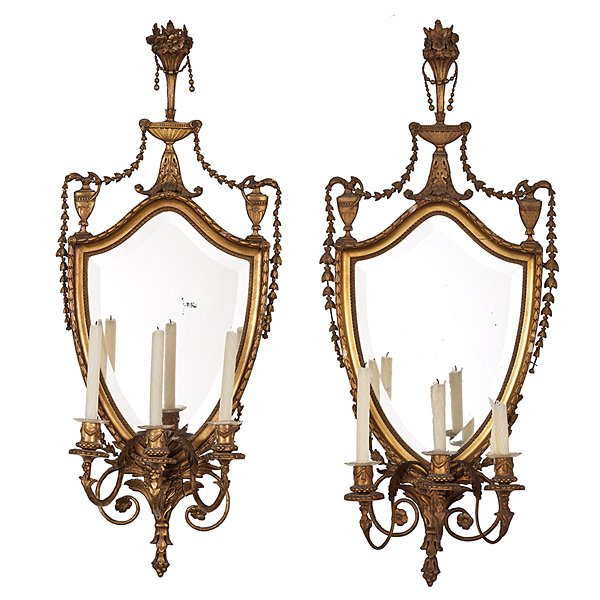 Adam-style Shield Form Sconces : Adam-style Shield Form Sconces English, 19th century. A pair of giltwood Adam-style shield form sconces with three candle sockets, beveled mirrors, surmounted with vase of flowers and two urns;