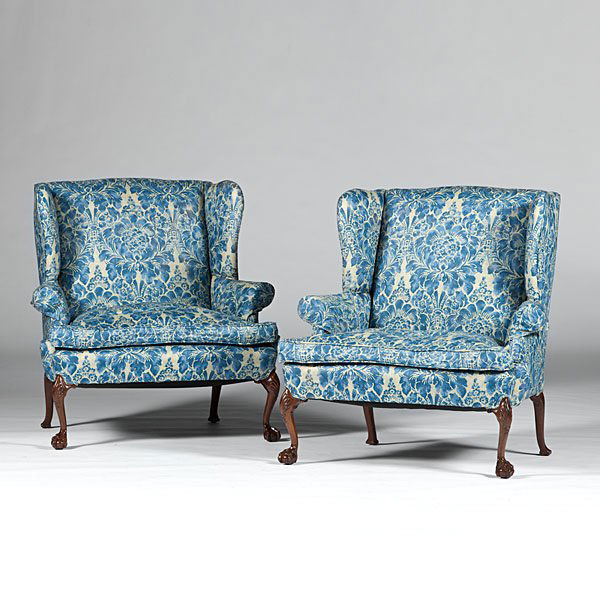 Georgian-style Settees : Georgian-style Settees English. A pair of Georgian-style carved walnut upholstered settees with scroll arms, front cabriole legs with shell carved knees and claw and ball feet; oah. 41.5, wd. 37.