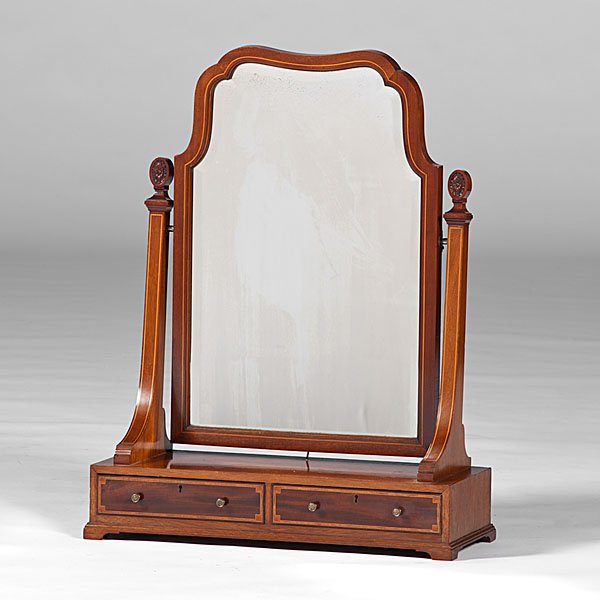 Edwardian Mahogany Shaving Stand : Edwardian Mahogany Shaving Stand English, 19th century. A mahogany inlaid shaving stand having a central arched and beveled mirror supported by inlaid and carved posts, over two aligned drawer
