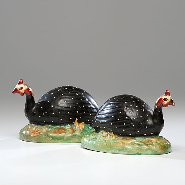 Staffordshire Creamware Guinea Hens : Staffordshire Creamware Guinea Hens English, 19th century. A pair of Staffordshire creamware Guinea hens, each having a hollow body in black with white dots, red combs on a green and tan base; ht.