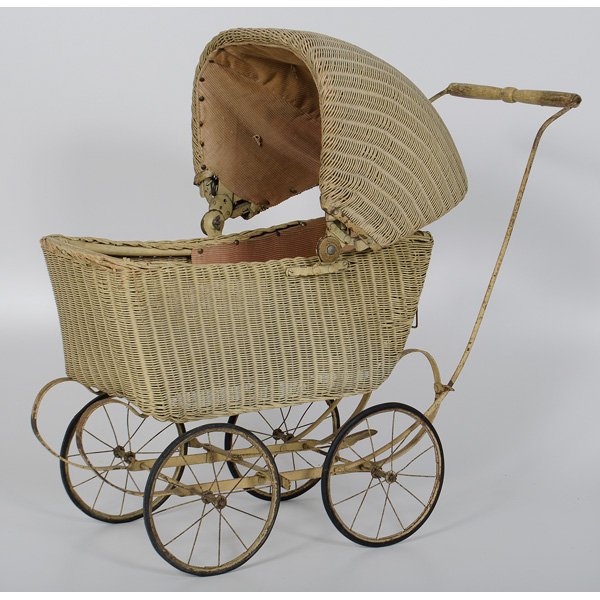 Wicker Doll Stroller : Wicker Doll Stroller 20th Century, American. A doll stroller with pink corduroy lining; ht. 30 wd. 31, dp.14.5 in.