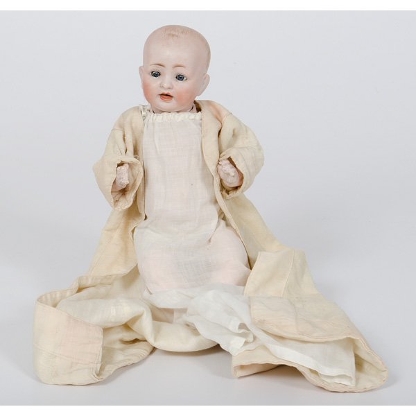 German Bisque Doll : German Bisque Doll German. A solid dome bisque porcelain head baby, gray glass sleep eyes, open mouth with two upper teeth, a tongue, molded and painted brown hair, marked on back of head Made/in/Ge