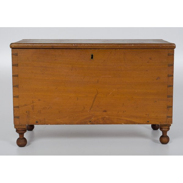 Miniature Blanket Chest : Miniature Blanket Chest American. A miniature blanket chest with open dovetailed construction, an interior till, a brass escutcheon and pegged ball feet; ht. 12, lg. 24, dp. 12 in.