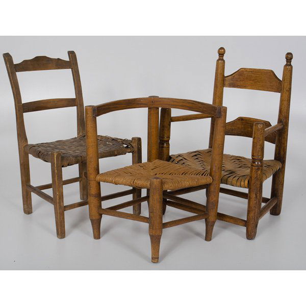Child's Chairs : Child's Chairs American, 19th century. An assembled group of three child's chairs, including one armchair with caned seat, shaped slats and turned arms, one corner chair with caned seat, and one s