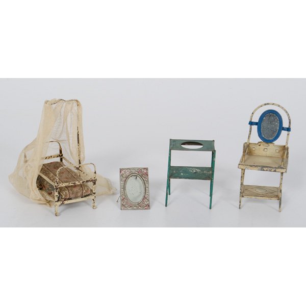 Tin Doll Furniture : Tin Doll Furniture A group of painted tin doll house furniture, including a vanity with mirror, a wash stand, a bed with mesh canopy, and a mirror; largest ht. 5 in.