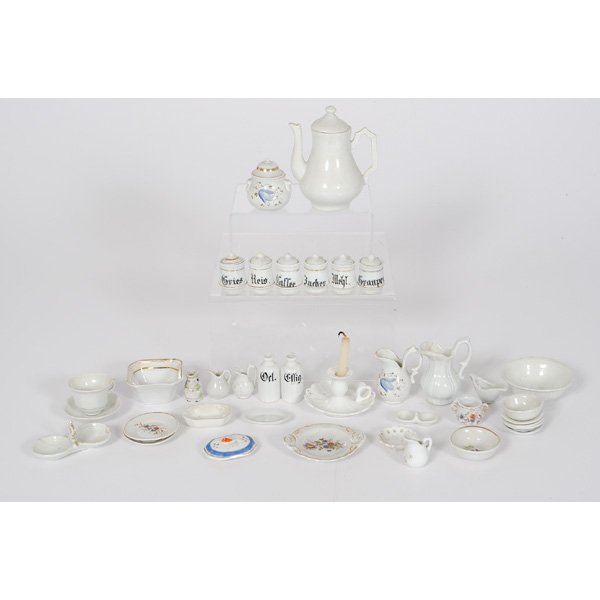 Miniature Stoneware Tablewares : Miniature Stoneware Tablewares A large assembled group of miniature china, including teapots, plates, candlesticks, set of German canisters and jugs. largest ht. 4 in.