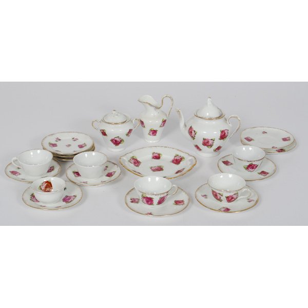 Miniature Tea Set in Rosette Pattern : Miniature Tea Set in Rosette Pattern Miniature tea set containing five teacups, six butter pats, five saucers, one serving plate, one creamer, one sugar, one teapot and one bowl; teapot ht. 5.5, wd