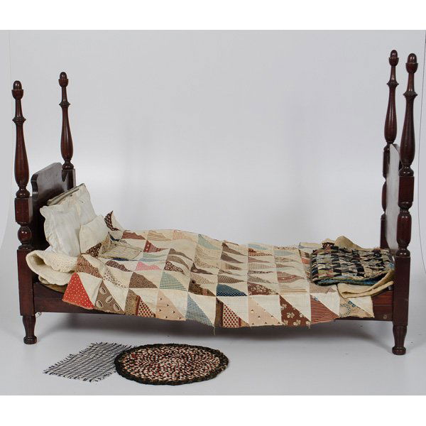 Four Poster Doll Bed with Assorted Linens : Four Poster Doll Bed with Assorted Linens Wooden doll bed with mattress and pillow, accompanied by small hand pieced star quilt, miniature hooked rug, four pillows, two small simple quilts, and hand