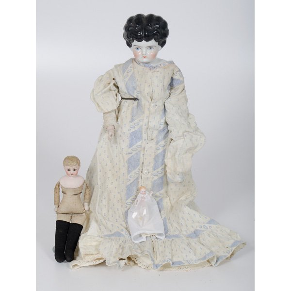 China Head and Bisque Dolls : China Head and Bisque Dolls Continental (probably German). Doll with porcelain head, blue eyes, black upswept hair, wearing period clothing over leather body, missing finger, one leg detached. Bisqu