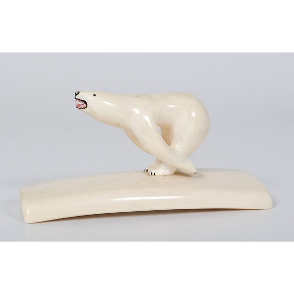 Northwest Coast Bear Carving : Northwest Coast Bear Carving American, 20th century. A polished walrus tusk carving of a running polar bear, signed Dwight N/ Savoonga AK; ht. 3.25, wd. 6.75, dp. 2.5 in.