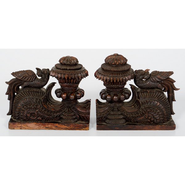 Carved Wood Book Ends : Carved Wood Book Ends Asian, 20th century. A pair of ornately carved hardwood book ends with dragons and urns set upon a scrolling foliate base; ht. 10.75, lg. 11.5 in.