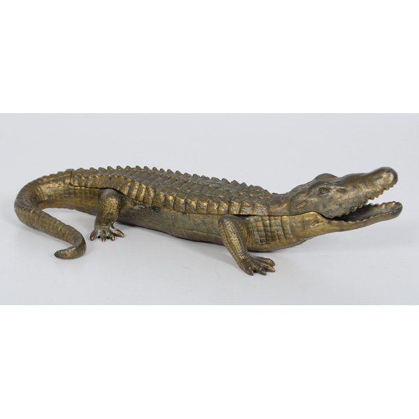 Bronzed Alligator Inkwell : Bronzed Alligator Inkwell American, 20th century. A cast bronzed metal alligator inkwell with hinged lid opening to reveal two copper ink pots, marked G & C Co / FLORIDA; lg. 10 in.