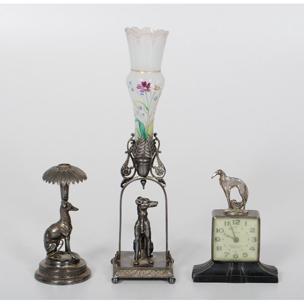 Greyhound Shelf Clock, Bud Vase and Trophy : Greyhound Shelf Clock, Bud Vase and Trophy American, late 19th/early 20th century. An assembled group of silver plated figural dog wares including a shelf clock on a raised base surmounted with a gr