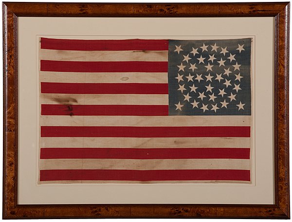 38-Star American Parade Flag : 38-Star American Parade Flag Cotton, 12 x 17.5 in., printed flag with 38 stars arranged on canton as follows: central cluster of 5 stars (cross), surrounded by double medallion of stars (11, 18), an
