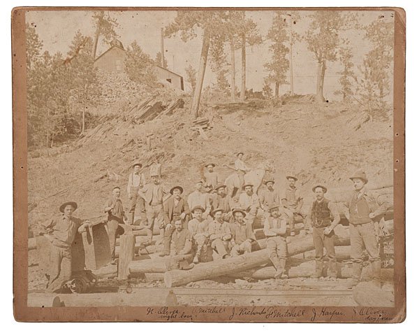 Photograph of a Group of Identified, South Dakota : Photograph of a Group of Identified, South Dakota Miners Albumen, outdoor photograph of a group of miners, with some identified in ink on the mount, including N. Oliver, night boss and J. Oliver,