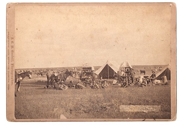 Grabill Photograph of Chuck Wagons and Cowboys, Da: Grabill Photograph of Chuck Wagons and Cowboys, Dakota Territory Roundup Albumen photograph captioned in negative No. 301. "A Mess Scene." Scene on "Round Up" of 1887 in Dakota. (Photo. and copyrig