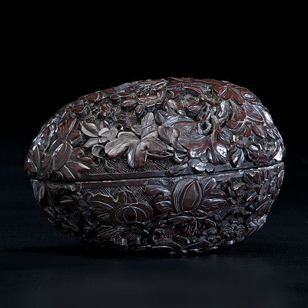 Finely Carved Cinnabar Lacquer Box : Finely Carved Cinnabar Lacquer Box 18th century. Carved cinnabar box with surface of rich brown lacquer, deeply carved with birds and butterflies over diapered ground; ht. 3.25 in.