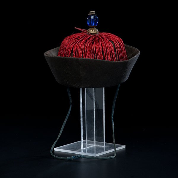 Chinese Official's Winter Cap : Chinese Official's Winter Cap Early 20th century. An official's tassled winter cap with a blue button indicating that the official was of the third rank; ht. 7 in. Ex Collection of Dr. Herman Ch