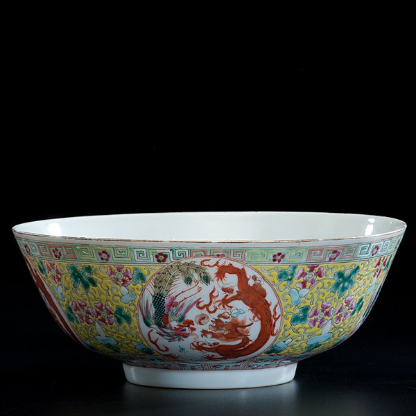 Chinese Guangxu Period Dragon Bowl : Chinese Guangxu Period Dragon Bowl Early 20th century, Guangxu period. A porcelain bowl having phoenix and dragon enamel decoration against a yellow ground with flowering gourds, dragon interior,