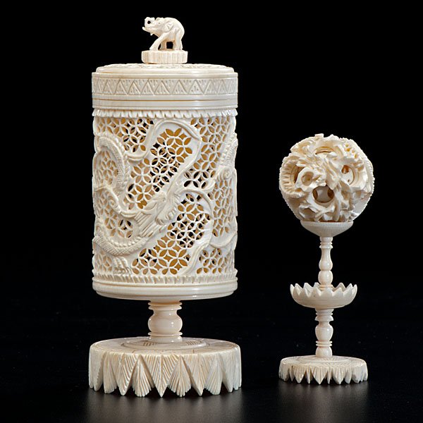 Chinese Ivory Carvings : Chinese Ivory Carvings China, a pair of ivory carvings, including a small puzzle ball and elaborate cricket cage; tallest 6.5 in.