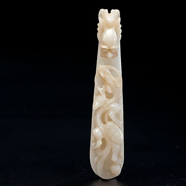 Chinese Jade Garment Hook : Chinese Jade Garment Hook Late 19th century. A chicken bone white jade garment hook, well carved and polished with dragon; lg. 4.25 in. Ex. Collection of President James A. Garfield (1831-1881). D