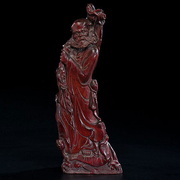 Chinese Horn Li Tiah Kuei Carving : Chinese Horn Li Tiah Kuei Carving 20th century. A vertical buffalo horn carving of Li Tiah Kuei clutching a large staff, the horn with shimmering red quality; ht. 10.5 in.