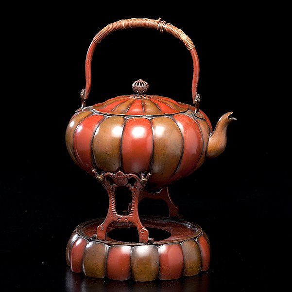Japanese Meiji Brass Hot Water Kettle : Japanese Meiji Brass Hot Water Kettle Meiji Period. A brass hot water kettle of lobated form, patenated in red and brown copper; ht. 8.5 in. Property of a Midwestern Collection