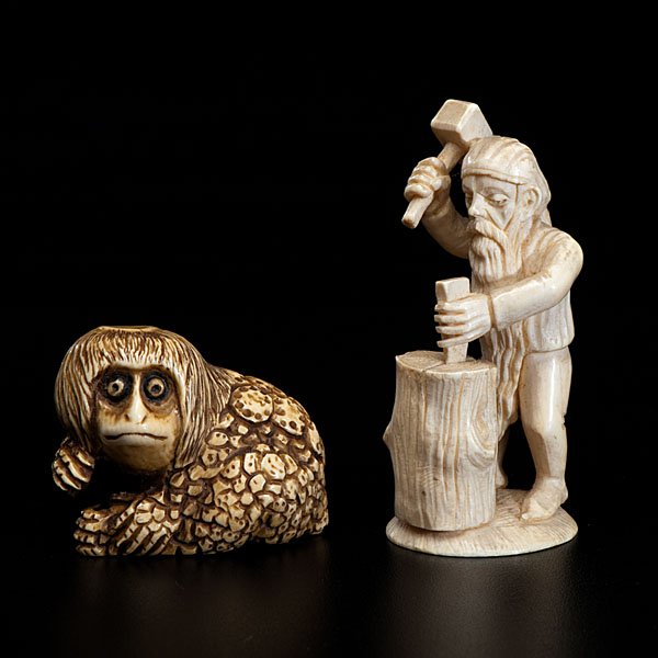 Pair of Unusual Ivory Netsuke : Pair of Unusual Ivory Netsuke 20th century. A pair of netsuke, the first appears German, with wood splitter, the second Japanese, intentionally stained and heavily inked, depicting a monkey with b