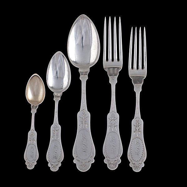 Duhme & Co. Coin Silver Flatware : American (Cincinnati), third quarter of 19th century. 31 pieces of coin silver flatware marked for Duhme & Co. (w. 1842-1888) with bright cut and rigglework design. Includes thirteen forks, six spoon