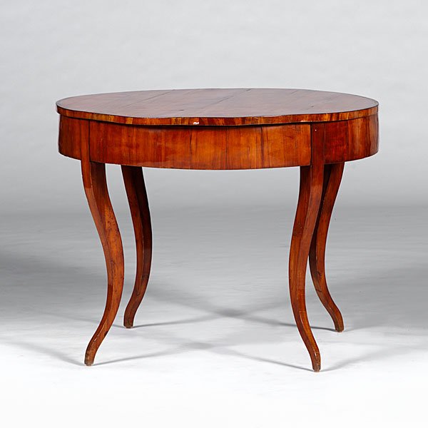 Biedermeier Fruitwood Center Table : Continental, ca 1830. A Biedermeier center table in figured fruitwood, the circular top with matched figured veneer panels with banded border, wide apron with vertical grain veneer fitted with a singl