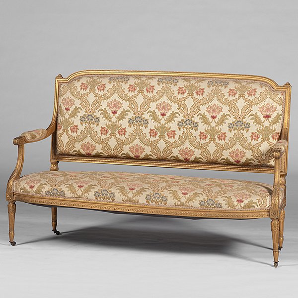Louis XVI-Style Settee : French, 19th century. A Louis XVI-style upholstered carved and giltwood settee with acanthus arms and fluted legs, on casters; ht. 40, lg. 59 in. Provenance: Property from the collections of Ann D