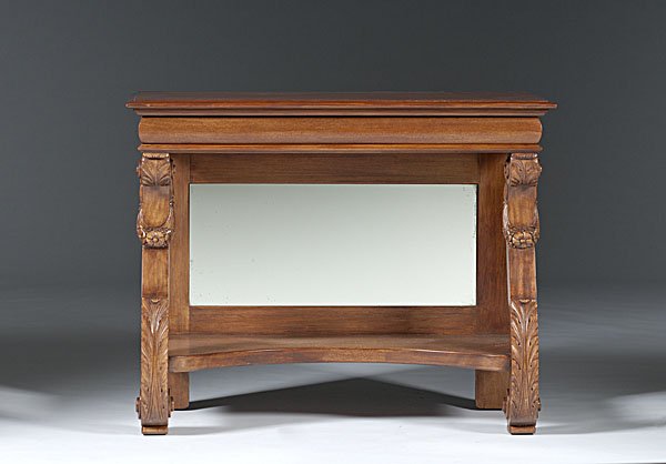 Late Classical-style Console Table : American, early 20th century. A late classical-style console table with carved and scrolled side support brackets, a mirrored back with shelf below; ht. 35, wd. 41.5, dp. 22 in.