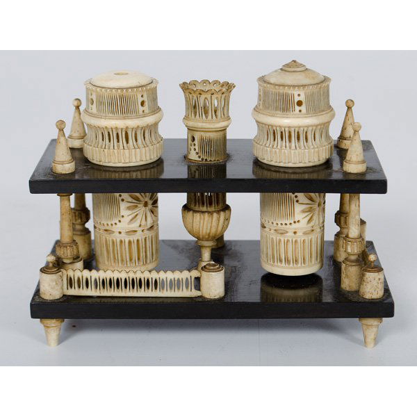 Anglo-Indian Mahogany and Ivory Sewing Stand : Anglo-Indian Mahogany and Ivory Sewing Stand Anglo-Indian, 19th century. A two tiered sewing stand of ebonized wood with carved and pierced ivory elements, including needle case and sealed capsule;