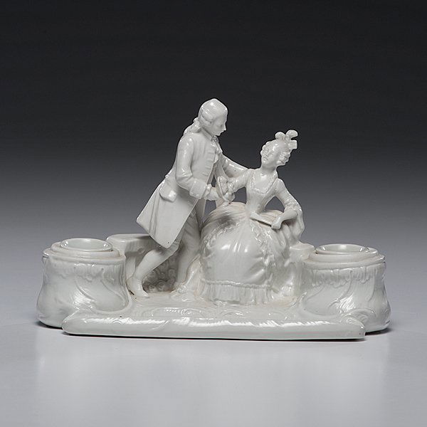 Capadimonte Encrier : Capadimonte Encrier Italian. Early Capodimonte Blanc de Chine soft paste porcelain encrier having a seated figure of a lady attended by a courtier and flanked by two relief molded and scrolled inkw