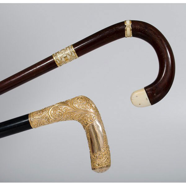 Walking Canes with Gold and Ivory Handles : Walking Canes with Gold and Ivory Handles Two gold handled walking canes. One is designed with a scrolling "L" handle, marked 14K. Second cane features sections of polished ivory with overlaid art